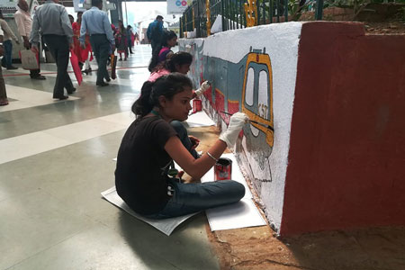 Student volunteers of Nature’s Club paint the Panvel Railway Station