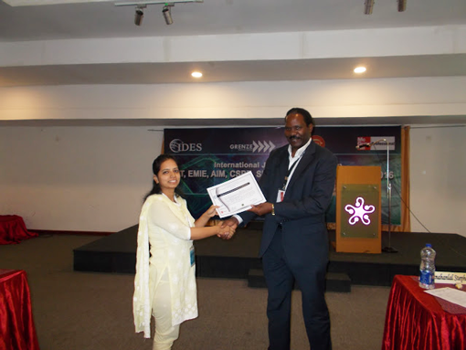 Ms.Pooja-Pandey-receiving-certificate-from-Dr.-Robert-Balagadde