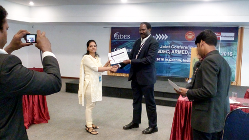 Ms.PoojaPandeyreceiving-certificate-from-Dr.-Robert-Balagadde